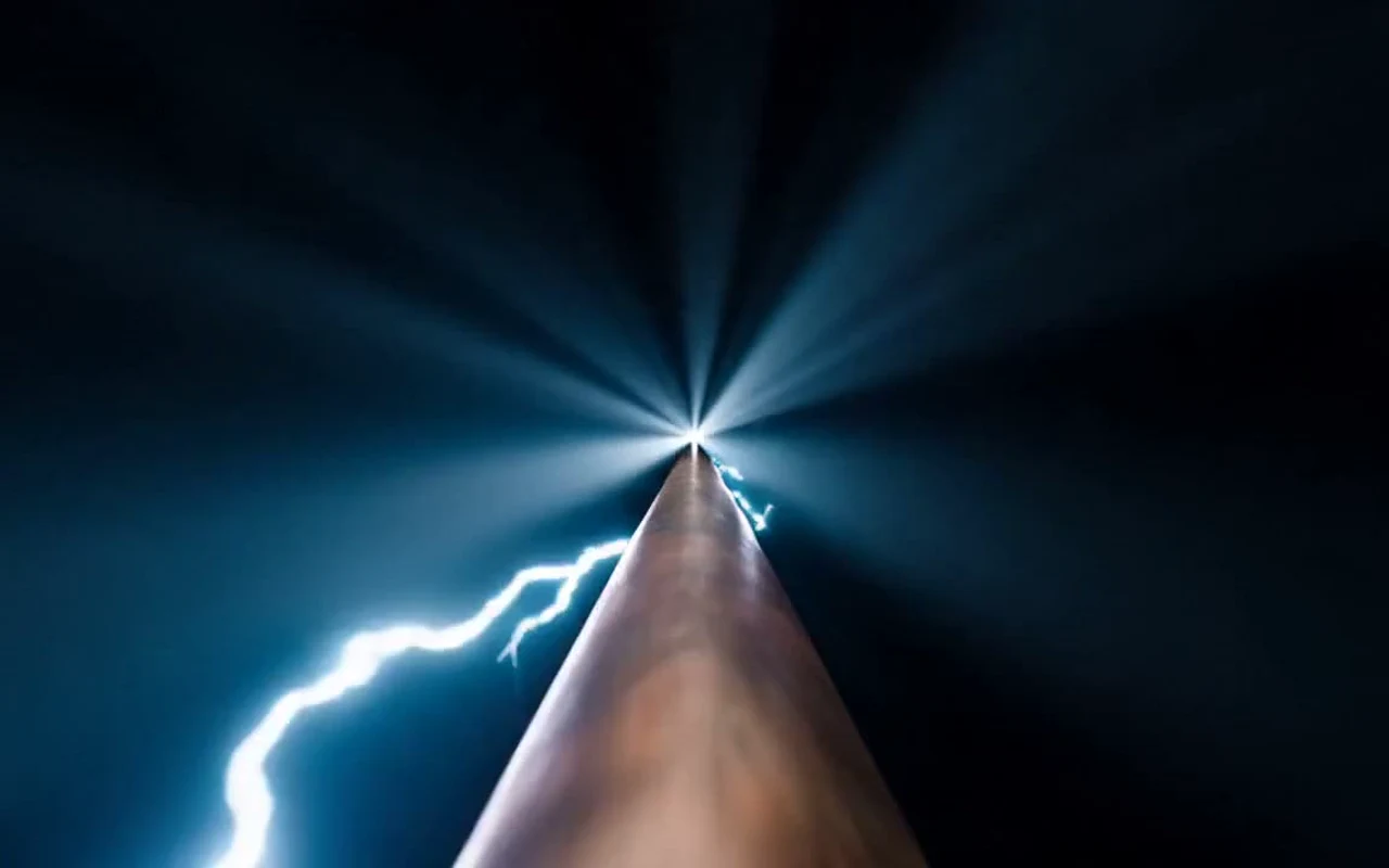 Electric current arcing along a copper wire — a frame from the Copperhead scroll-film site